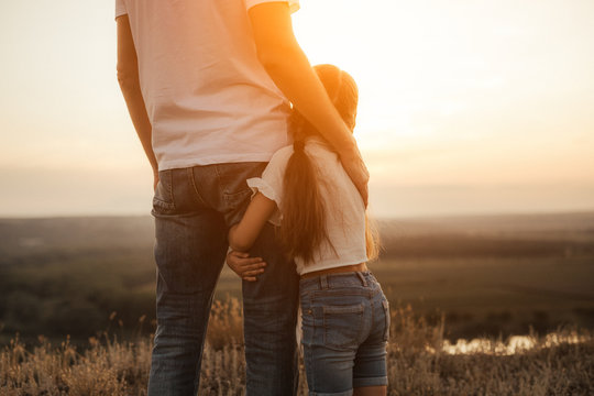 Happy Father And Daughter Hugging While Standing At Countryside