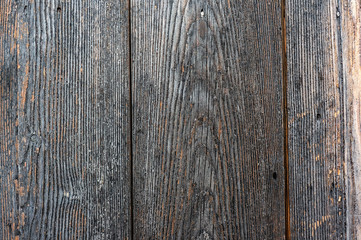 Texture of old wooden wet planks. Old vintage aged grunge dark brown and gray wooden floor planks