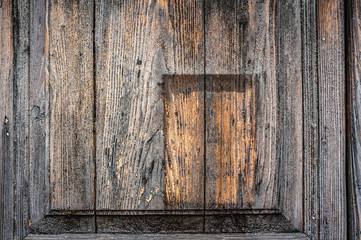 Background of old wooden boards with convex insert and wood. Wood texture