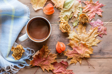 beautiful autumn composition with tea. autumn leaves and cups with grape sugar on a rustic tree background. the concept of the fall season. soft selective focus