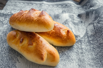 Freshly baked fragrant homemade small meat pies with an appetizing crust. Russian national cuisine