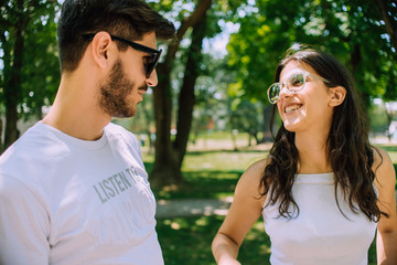 Obraz premium Romantic couple walking through summer woodland