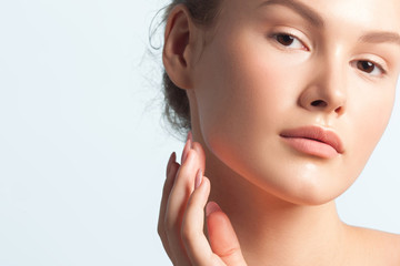 Naklejka premium Young beautiful woman with clean perfect skin close-up