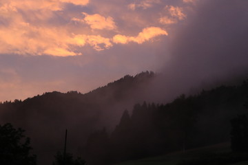 foggy sunset in the mountains with fog
