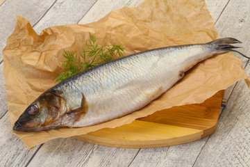 Salted herring over the wooden board