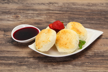 Curd pancakes with jam and stravberry