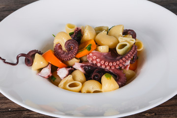 Pasta with octopus and yellow tomatoes