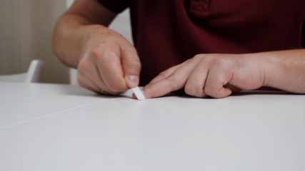 A man takes care of his nails at home. Beauty, care, health