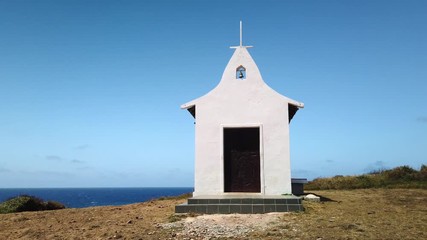 Sao Pedro dos Pescadores, Saint Pedro of Fishermen Chapel at Fernando de Noronha Island, Pernambuco, Brazil - July, 2019 - Beautiful 4k footage in a blue sky day