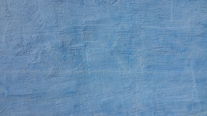 Textured blue wall background facade