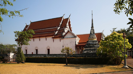 Old Thai buddhist tample with clear blue sky
