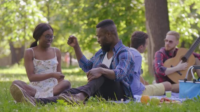 Young people on lunch break in park