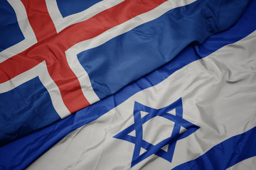 waving colorful flag of israel and national flag of iceland.