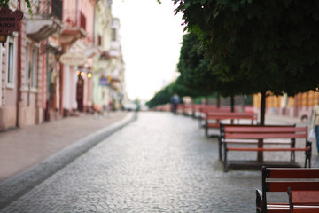 Fototapeta na wymiar Blurred background bokeh pedestrian street of old European city