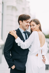  love story in the European style. happy couple on the background of the evening city.