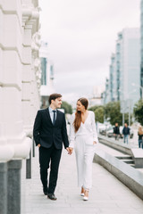  love story in the European style. happy couple on the background of the evening city.