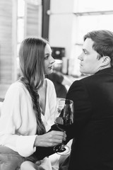 happy couple in the interior of a wine bar. bright emotions in a family photo shoot.