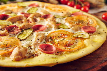 Homemade pizza on wooden table top view