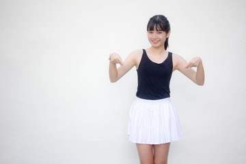 Portrait of thai adult beautiful girl black shirt white skirt pointing