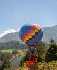 Photo spot Air balloons against a background of hills and mountains.