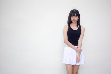 Portrait of thai adult beautiful girl black shirt white skirt relax and smile