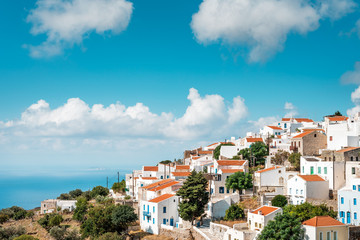 Typical Greek mountain village of Nikia with white houses and red roofs, Nisyros Island, Greece