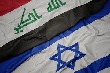 waving colorful flag of israel and national flag of iraq.