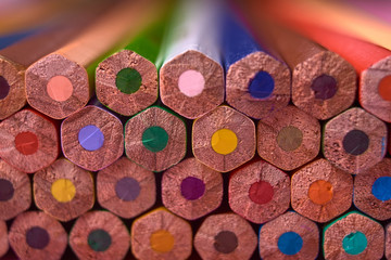 Color pencils on pink pastel background, close up. Set of colorful pencils, copy space. Crayons. Selective focuse. Back to school, college concept. Abstract background