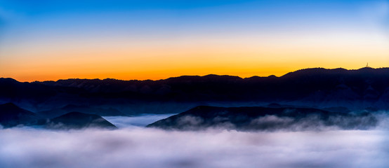 Fototapeta na wymiar Sunrise panorama with Fog in Valley