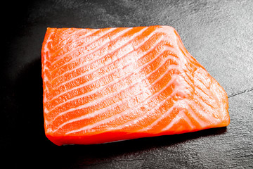 Beautiful salmon fillet on slate plate
