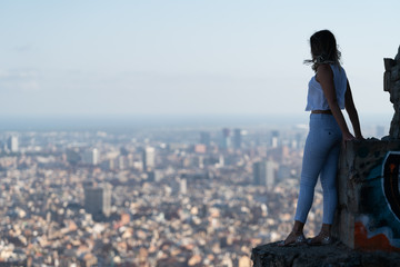 young beautiful caucasian woman with the background city