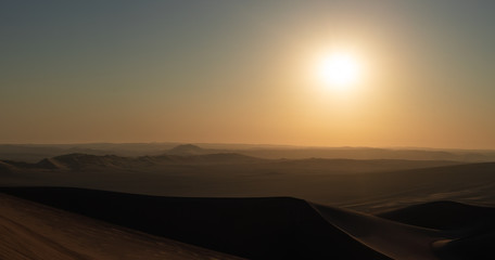 Fototapeta na wymiar Panoramic view of a desert sunset