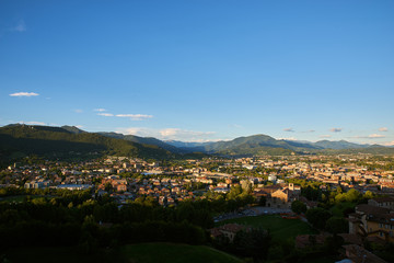 Fototapeta na wymiar Bergamo with Alps mountains and blue cloudy sky