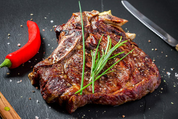 Grilled club steak on slate plate
