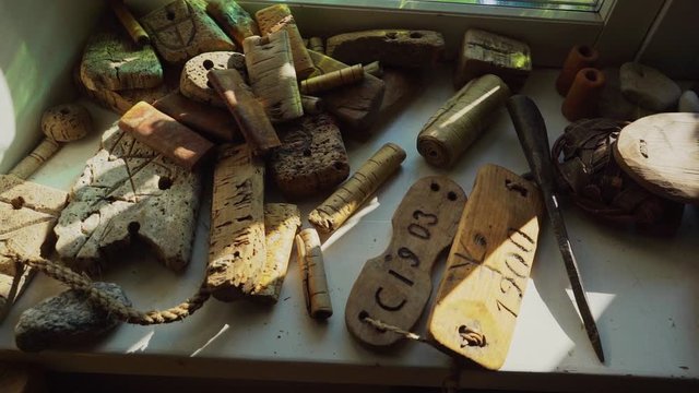 Ancient fishing devices on the wall. Maritime Museum indoors. Slow motion footage.