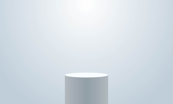 Realistic empty round podium with spotlight effect. Pedestal or white round cylinder stand on white background. Mock up template for your design. Concept for advertising or presentation. © Gurt