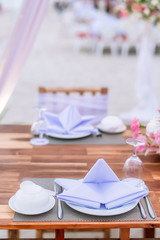 Romantic dinning table on the beach . Table setting at a luxury wedding and Beautiful flowers on the table. dinner table on the sand beach.