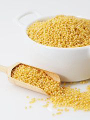 Dried raw millet on the white background