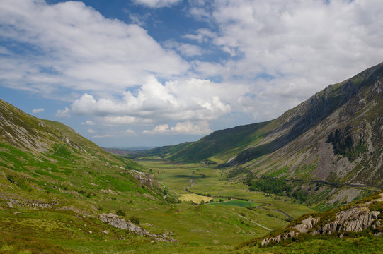 View across fields and valley. Snowdonia is a mountain range and a region in North of Wales.