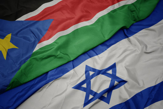 Waving Colorful Flag Of Israel And National Flag Of South Sudan.