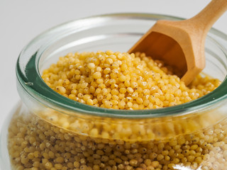 Dried raw millet on the white background