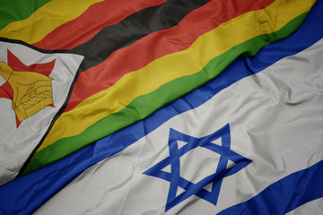 waving colorful flag of israel and national flag of zimbabwe.