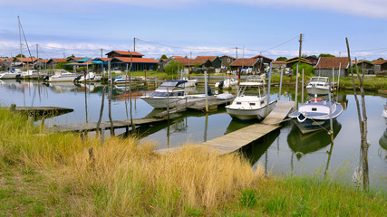 Fototapeta na wymiar Panoramic photo of ostreicole harbor of La Teste de Buch, commune is a located on the shore of Arcachon Bay, in the Gironde department in southwestern France.