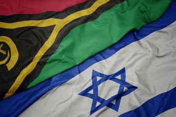waving colorful flag of israel and national flag of Vanuatu .