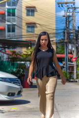Business woman walking  Lawyer professional or similar walking outdoors be serious  Multiracial Asian / Caucasian businesswoman have stressed outside.