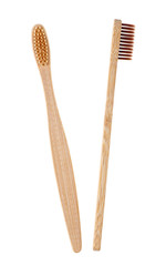 Two brown wooden toothbrushes on a white background. Bamboo toothbrush.