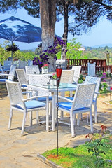 Cafe on the open air with white furniture