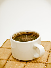 Tasty cup of coffe with bean coffe