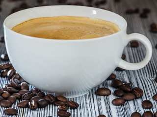 Tasty cup of coffe with bean coffe