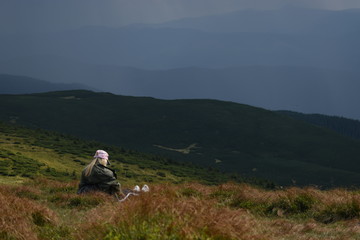 Tourist standing on Carpathian Mountains overlooking the Goverla view